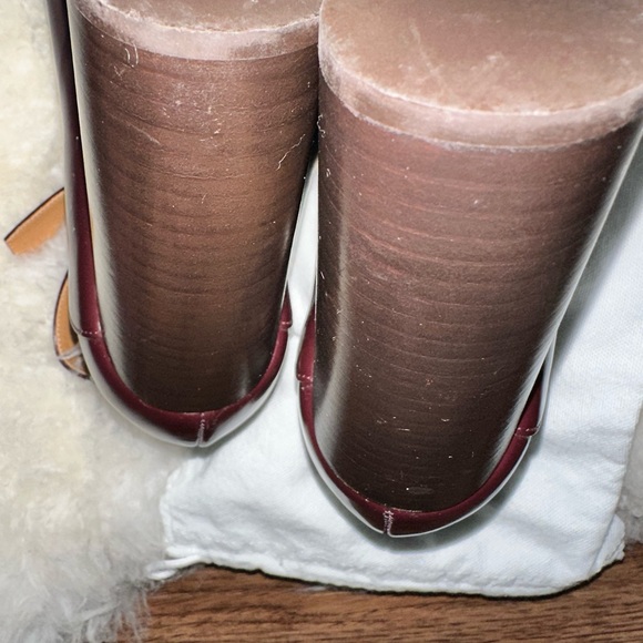 - [ ] Burgundy leather Chloé round-toe pumps with brass hardware, stacked heel - Picture 6 of 8